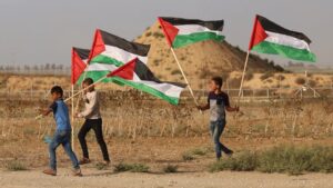 palestine-gaza-border-fence-flags-4-july-afp.jpg